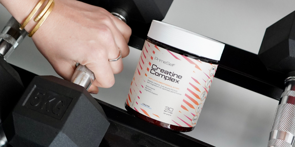 PrimeSelf Creatine Complex next to a person picking up weights